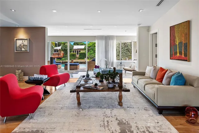 a living room with furniture and a large window
