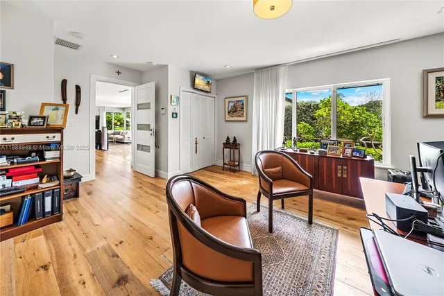 a bathroom with a tub a sink and a shower