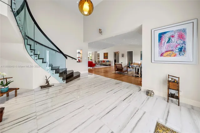 a room with a bed and a large window