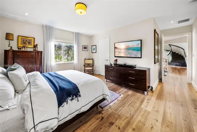 an aerial view of a house with swimming pool a yard and outdoor seating