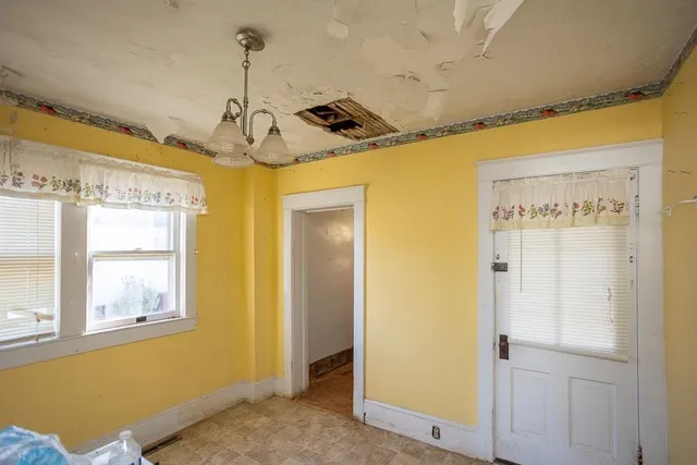 a bathroom with a sink mirror and vanity