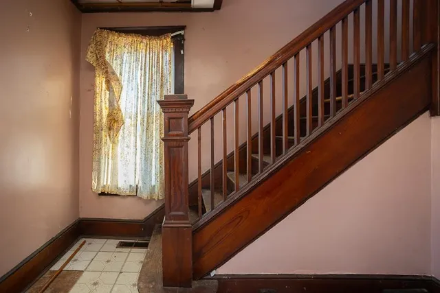 a white bath tub sitting next to a toilet