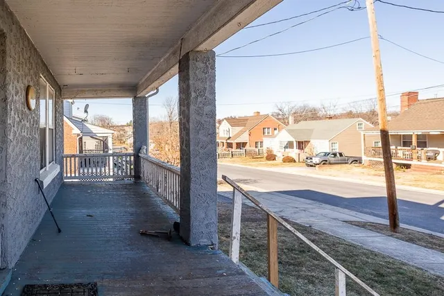 a view of balcony with wooden floor
