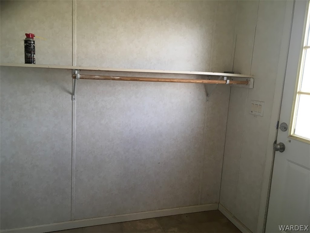 458 Heber Road Golden Valley, AZ 86413 - Photo 12 of 32 Hanging bar for clothes out of the dryer. Could also accommodate a freezer and extra storage cabinets.