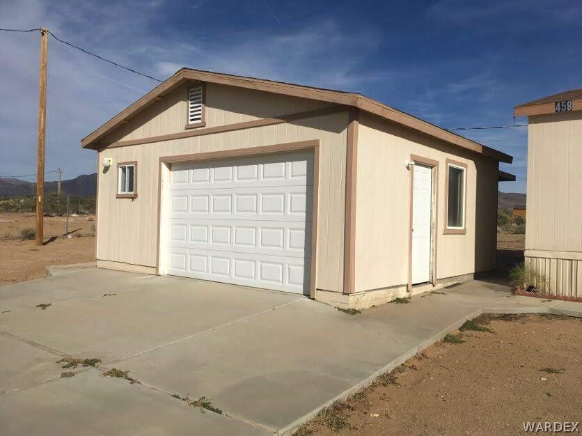 458 Heber Road Golden Valley, AZ 86413 - Photo 3 of 32 Garage with storage room and half bath.