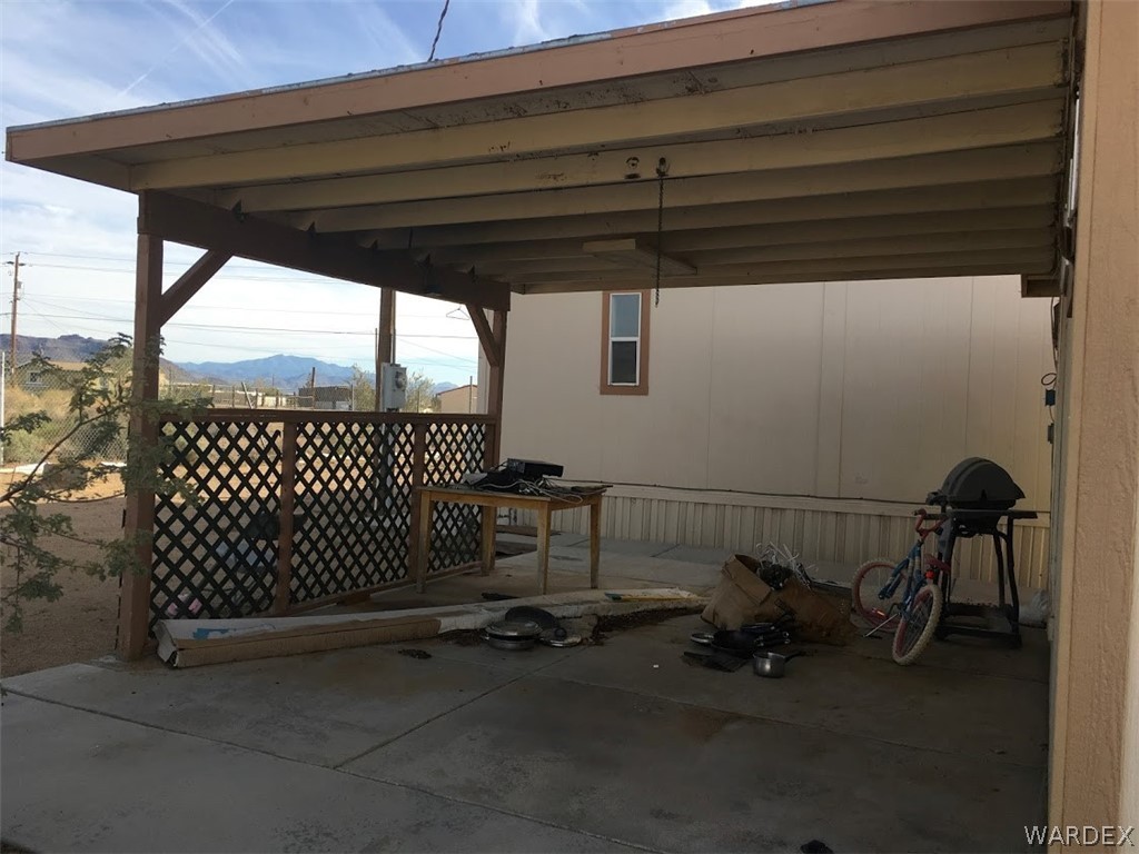 458 Heber Road Golden Valley, AZ 86413 - Photo 6 of 32 Covered BBQ patio will be cleaned up and ready to relax and enjoy the shaded evenings!