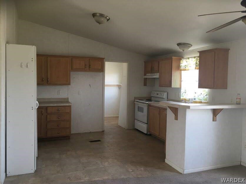458 Heber Road Golden Valley, AZ 86413 - Photo 9 of 32 Spacious kitchen has lots of drawers and storage.