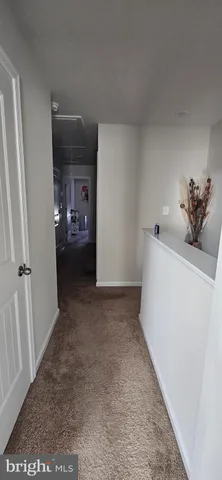 a view of hallway with livingroom