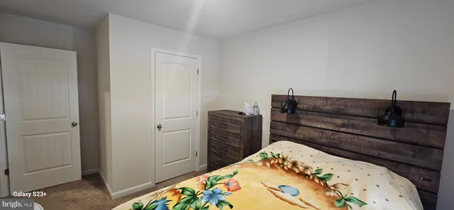 a bed room with a bed and furniture