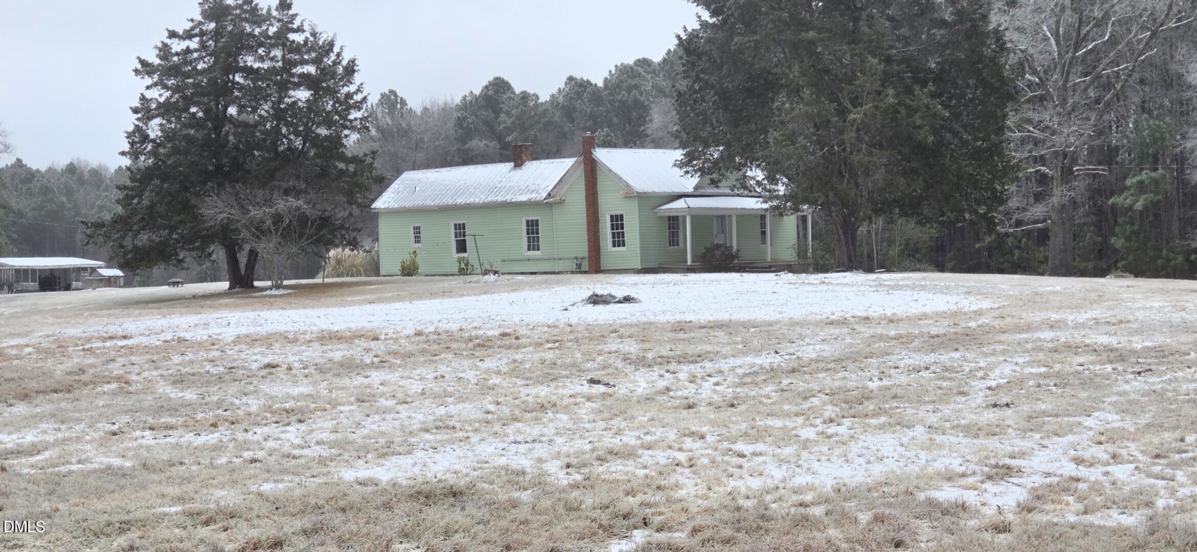 2523 Hamlin Road Durham, NC 27704 - Photo 16 of 19 a front view of a house with a yard covered in snow