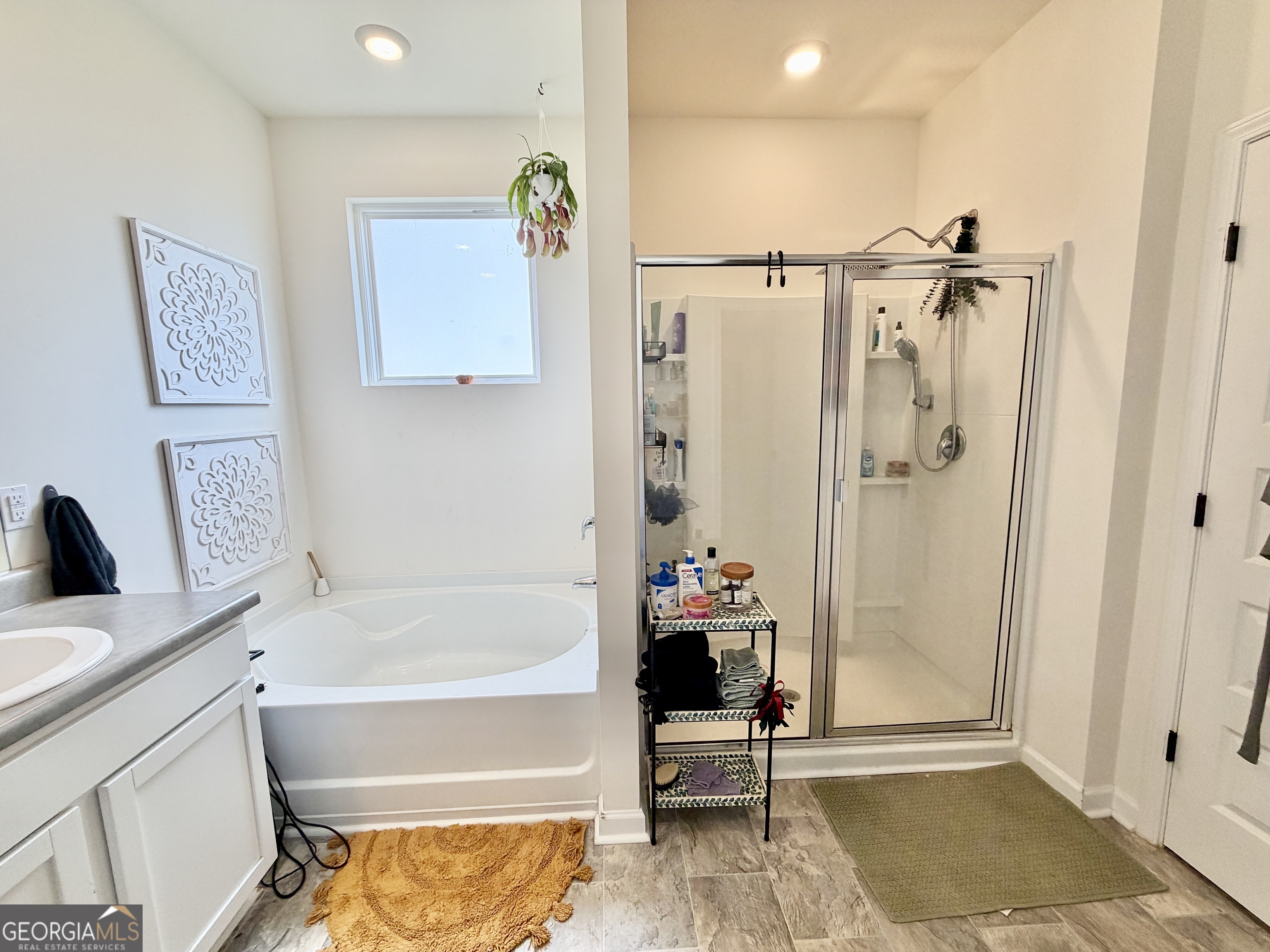219 Barnyard Way Perry, GA 31069 - Photo 24 of 44 a bathroom with a tub and shower