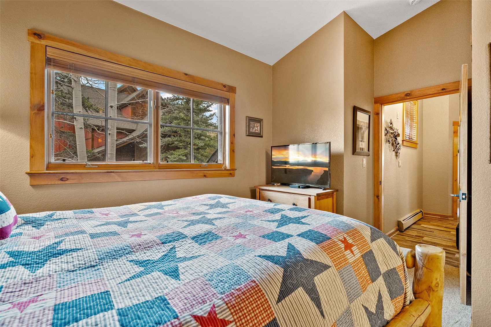 57 Lake Ridge Circle, Unit 1848 Keystone, CO 80435 - Photo 29 of 49 a bedroom with a bed and a large window