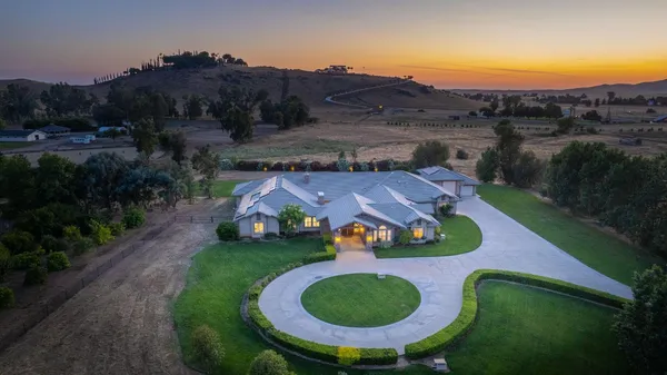 an aerial view of residential house with outdoor space swimming pool