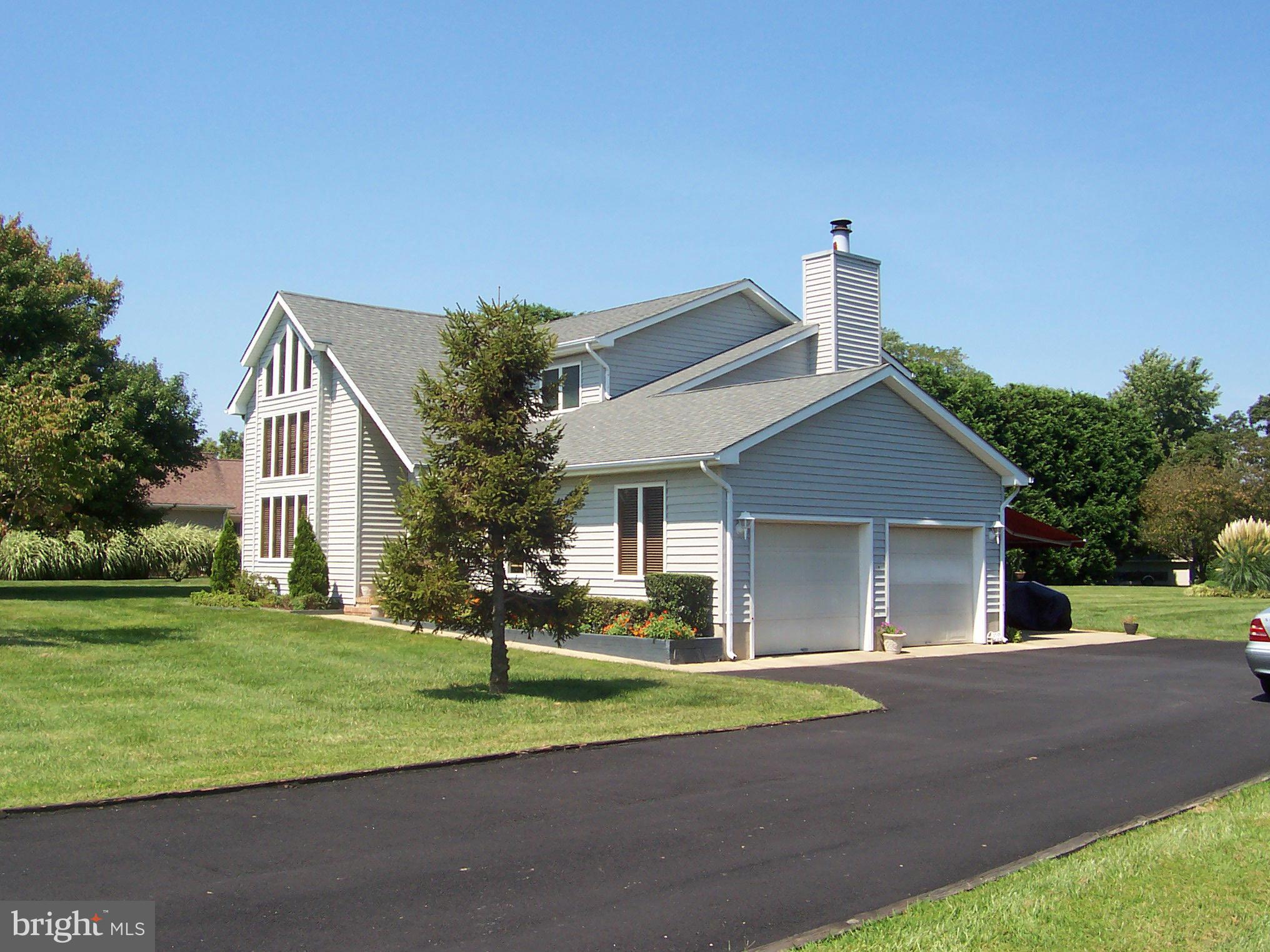 603 Old Point Road Chester, MD 21619 - Photo 1 of 30 a view of a house with a yard and large tree