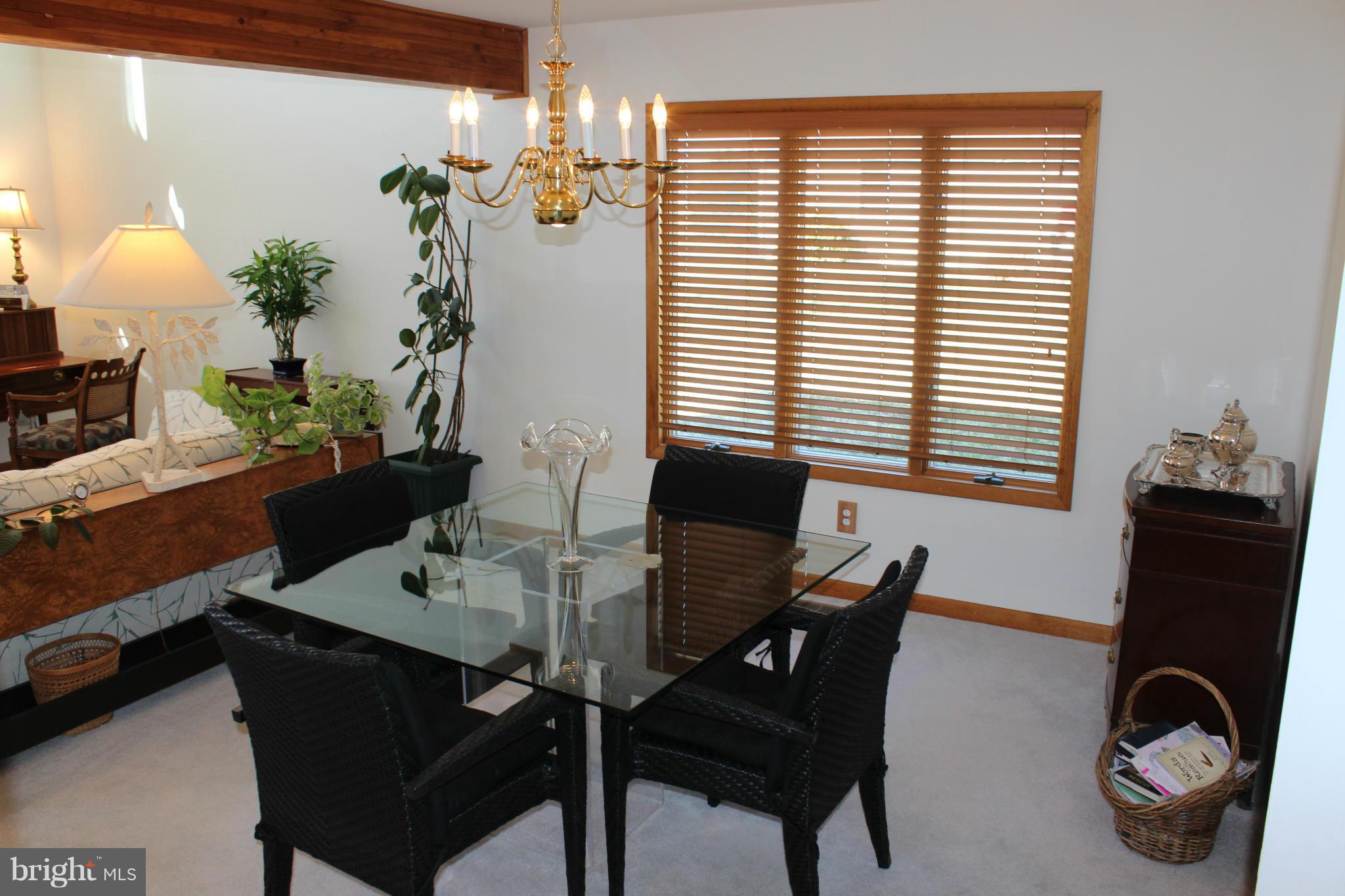 603 Old Point Road Chester, MD 21619 - Photo 14 of 30 a view of a dining room with furniture and window