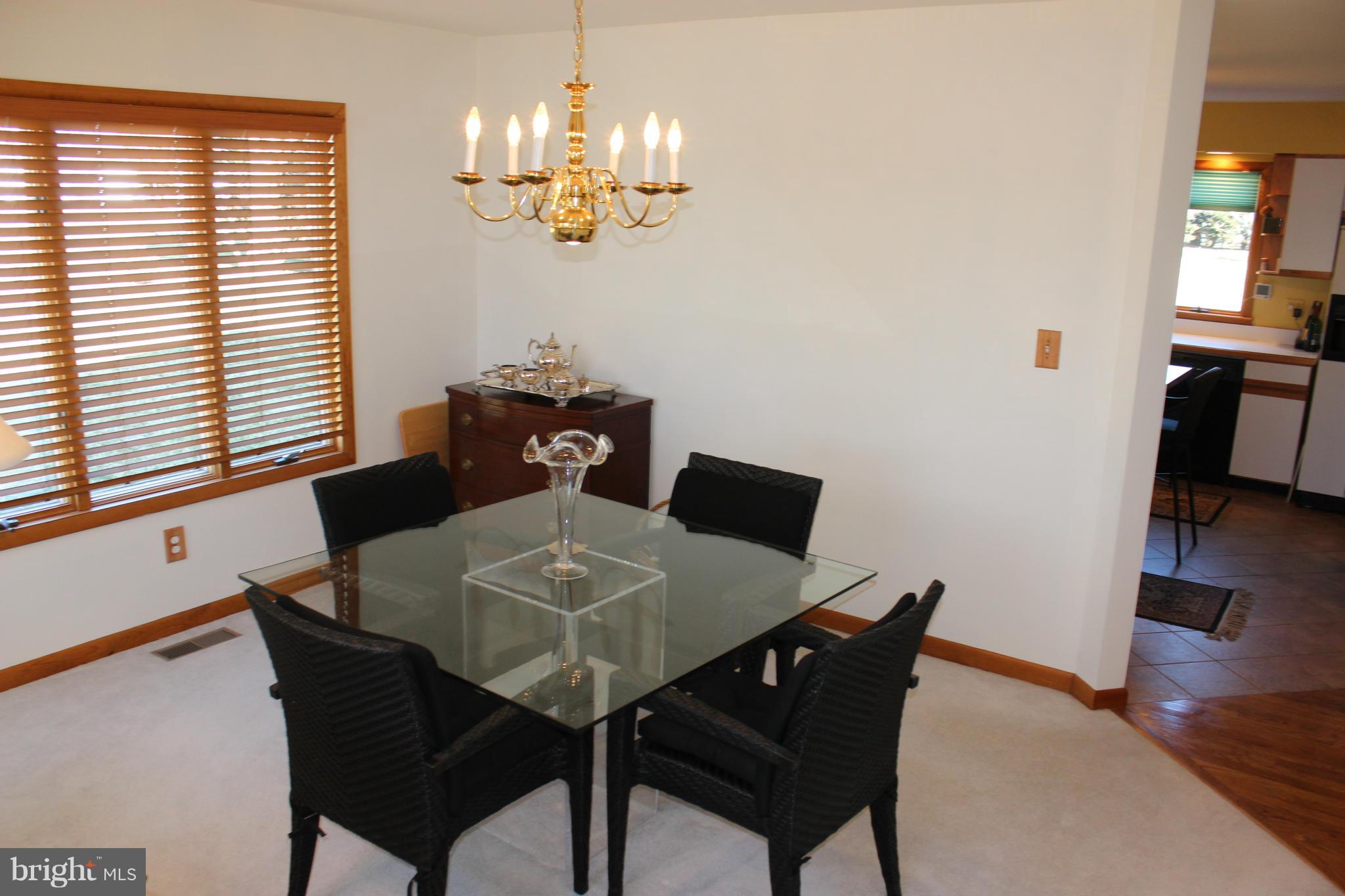 603 Old Point Road Chester, MD 21619 - Photo 29 of 30 a view of a dining room with furniture and wooden floor