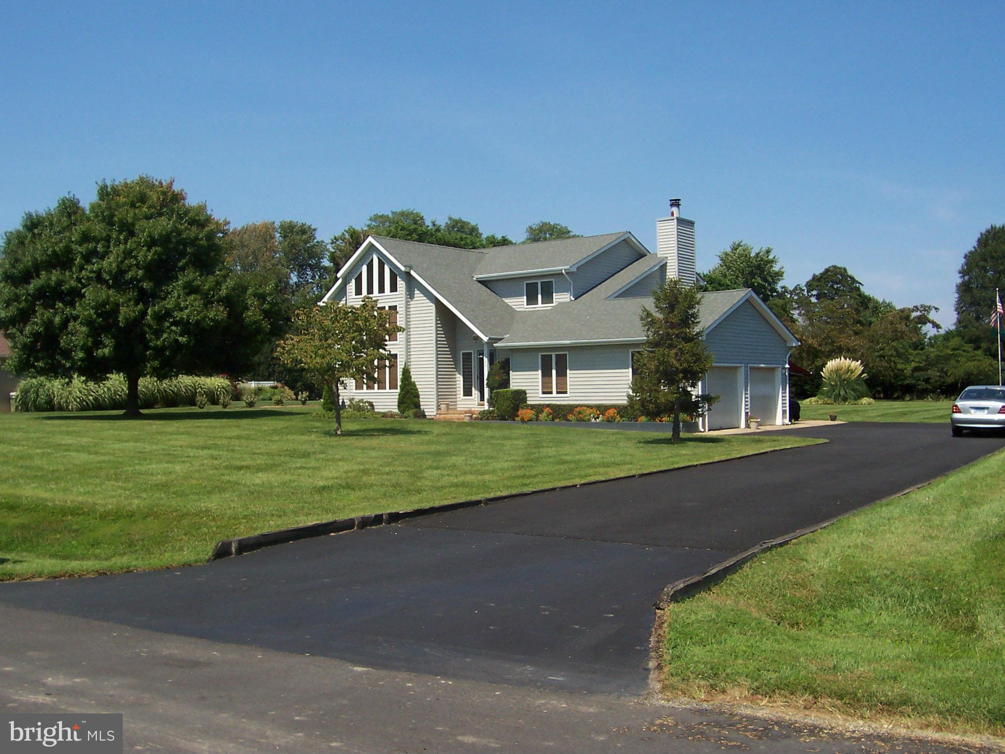 603 Old Point Road Chester, MD 21619 - Photo 5 of 30 a front view of a house with a yard