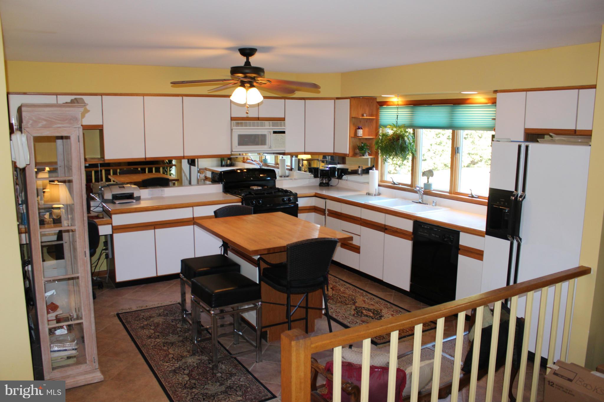 603 Old Point Road Chester, MD 21619 - Photo 6 of 30 a kitchen with stainless steel appliances a stove a sink and a refrigerator