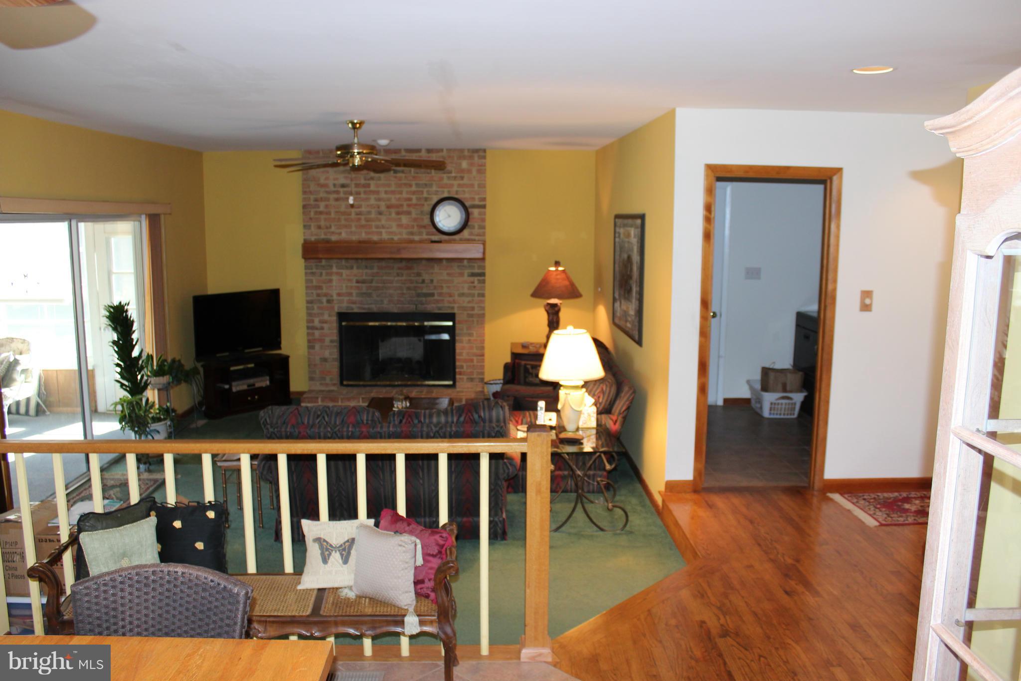 603 Old Point Road Chester, MD 21619 - Photo 8 of 30 a view of living room with furniture and fireplace
