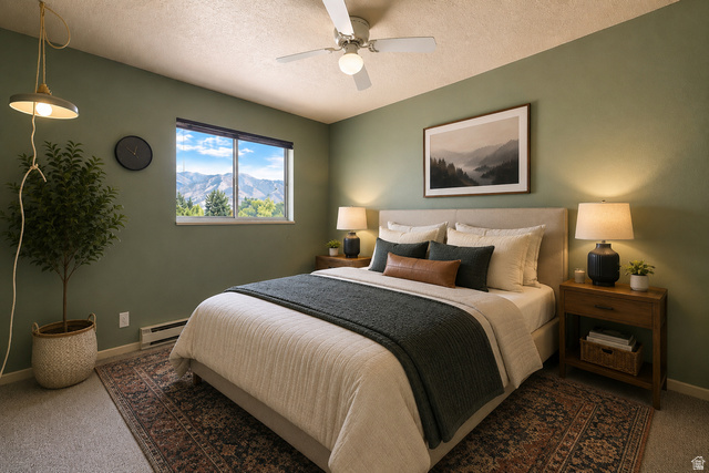 285 West 600 North, Unit 2 Logan, UT 84321 - Photo 13 of 21 Bedroom featuring a window with mountain scenery, a ceiling fan, and a neutral upholstered bed frame