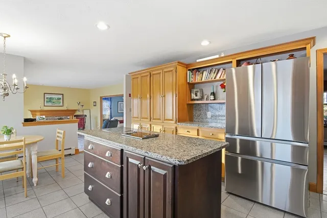 a kitchen with a table and chairs