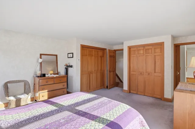 a bedroom with a bed and furniture