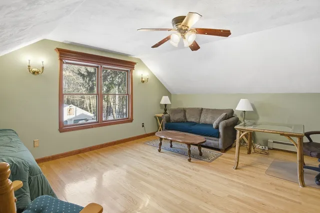 a bedroom with furniture and a window