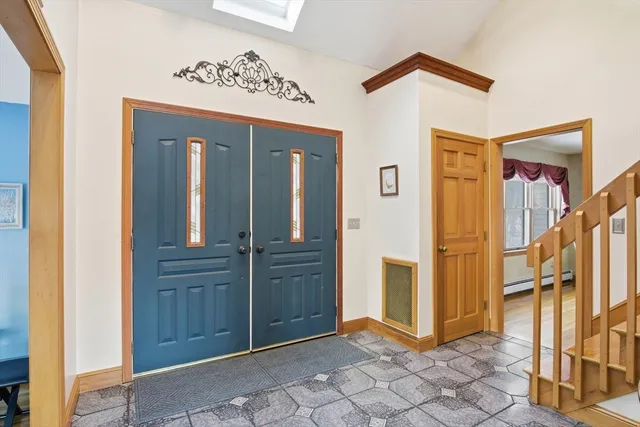 a view of a hallway with entryway door