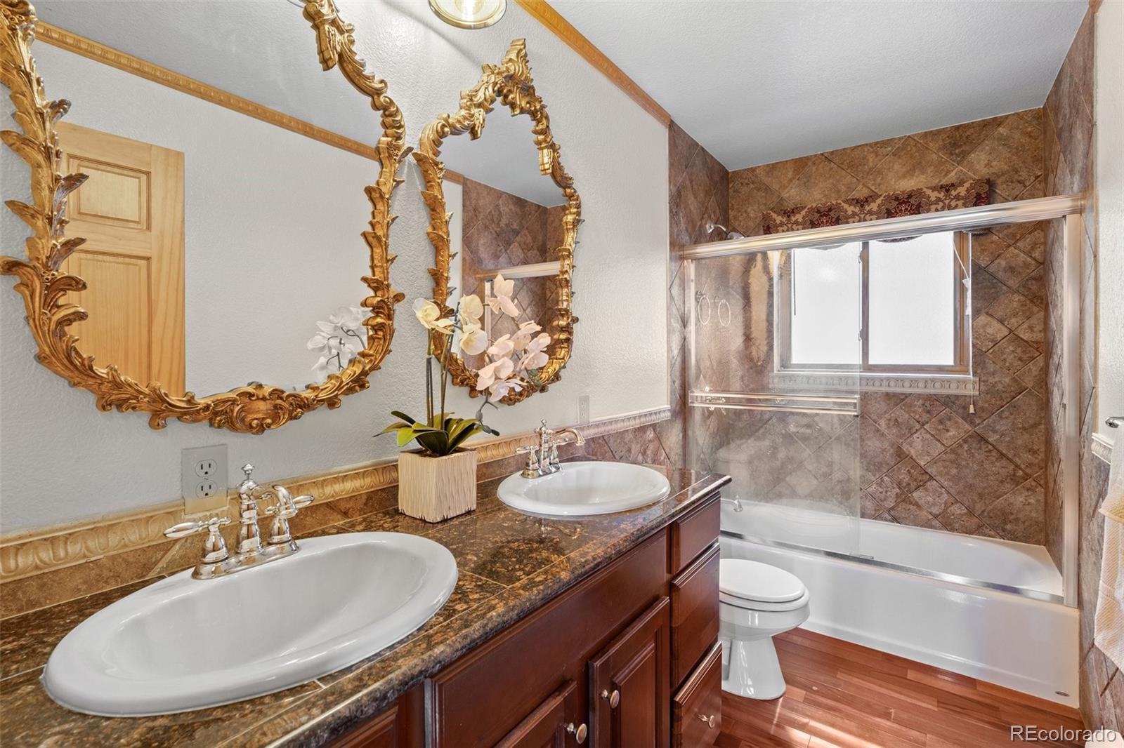 10248 Christopher Drive Conifer, CO 80433 - Photo 26 of 40 a bathroom with a granite countertop sink and a mirror