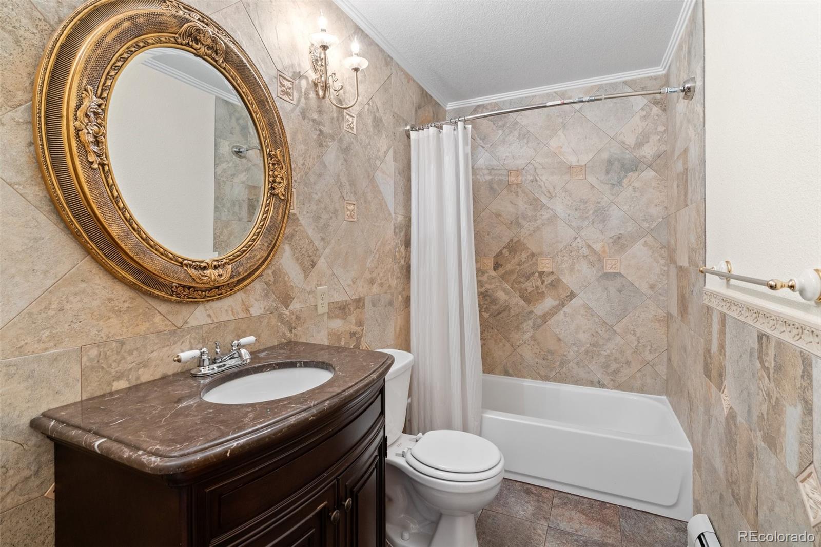 10248 Christopher Drive Conifer, CO 80433 - Photo 32 of 40 a bathroom with a sink a toilet and a mirror