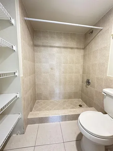 a bathroom with a bathtub and a toilet