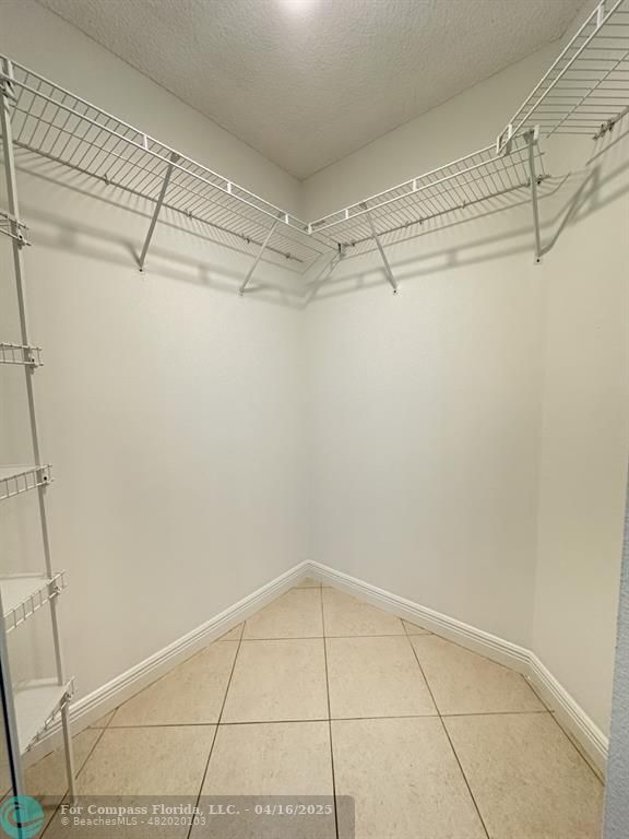 9401 Lime Bay Boulevard, Unit 115 Tamarac, FL 33321 - Photo 13 of 18 a view of a room with racks on the wall