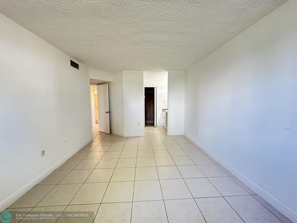 9401 Lime Bay Boulevard, Unit 115 Tamarac, FL 33321 - Photo 10 of 18 a view of an empty room and window