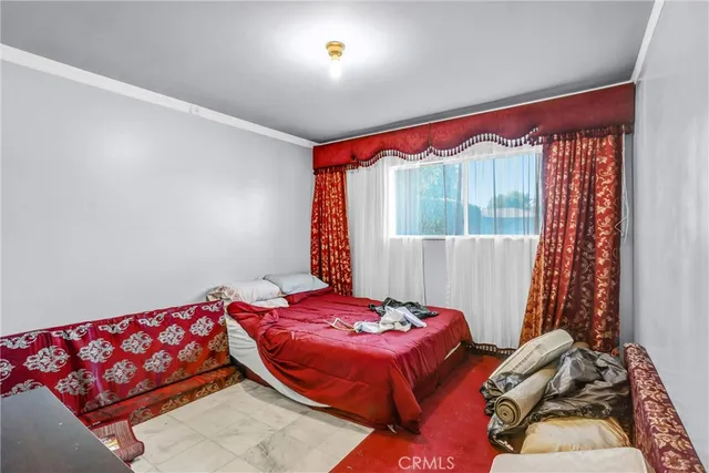 a bed room with a bed and a couch