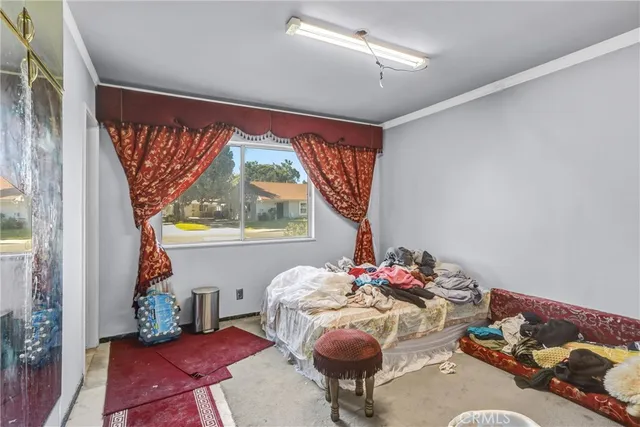 a kitchen with refrigerator and cabinets