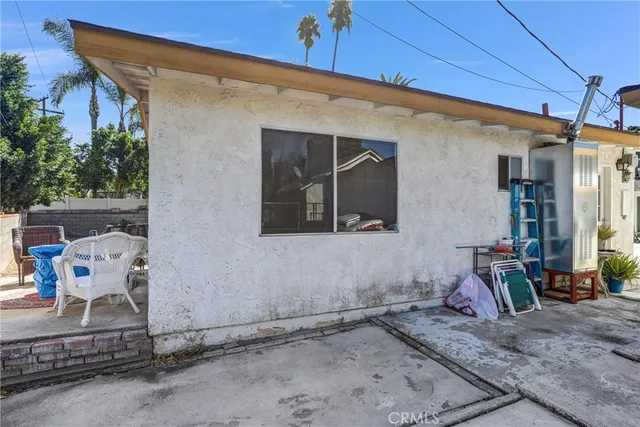 a view of walk in closet with clothes