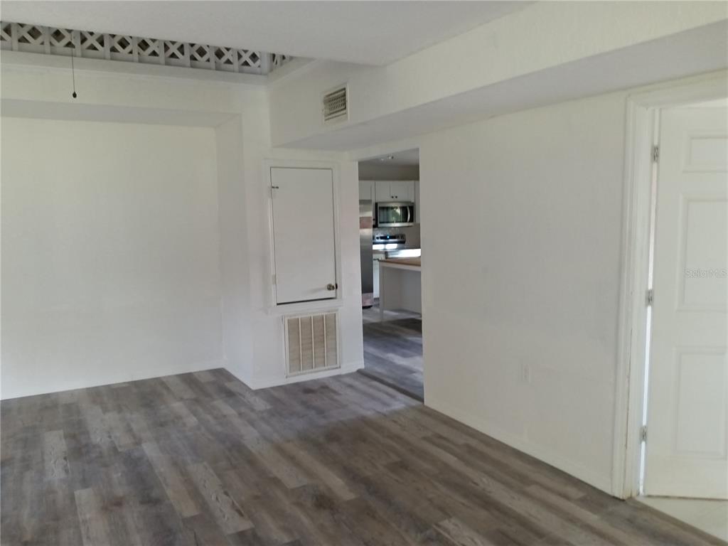 445 State Rte 415 Osteen, FL 32764 - Photo 12 of 14 a view of a kitchen with wooden floor