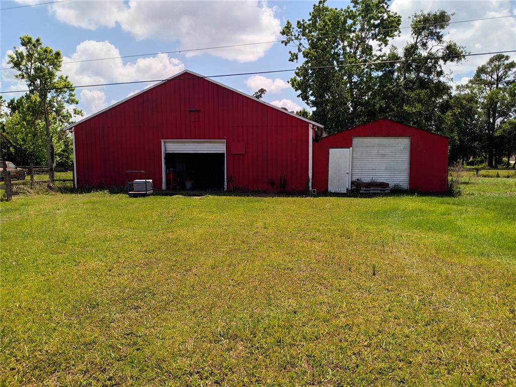 445 State Rte 415 Osteen, FL 32764 - Photo 18 of 25 a house with yard in front of it