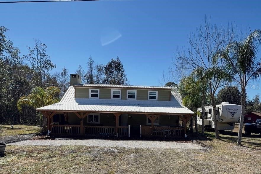 445 State Rte 415 Osteen, FL 32764 - Photo 2 of 25 a front view of a house with a yard