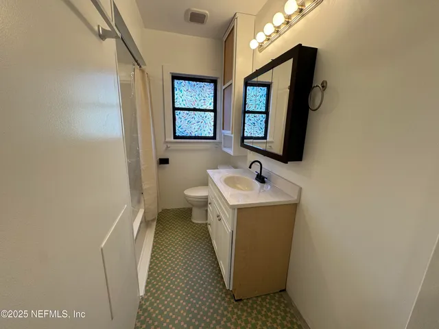 a utility room with sink dryer and washer