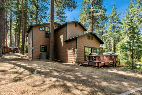 a living room with furniture fireplace and flat screen tv