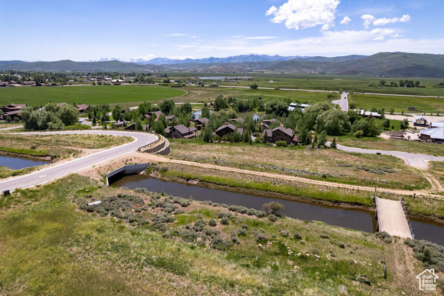 883 Wasatch View Drive, Unit 11 Kamas, UT 84036 - Photo 2 of 14 View of mountain background featuring a large body of water and rural landscape