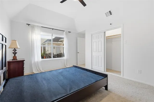 a room that has a bed and a window