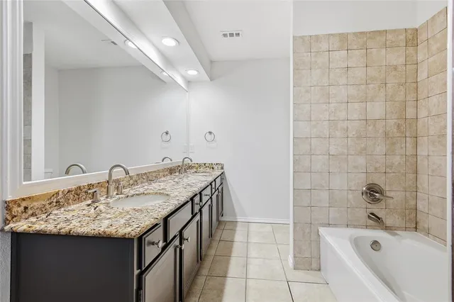 a bathroom with a sink and a bathtub