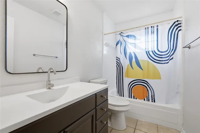 a bathroom with a sink a mirror and a rug