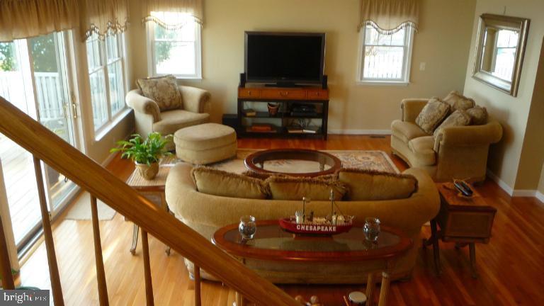 8563 Bay Road Pasadena, MD 21122 - Photo 12 of 25 Living room 1st.,floor looking from the staircase.