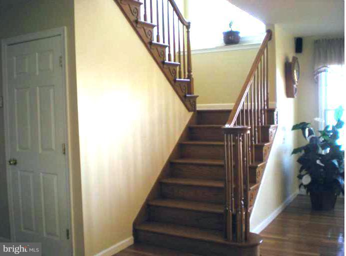 8563 Bay Road Pasadena, MD 21122 - Photo 13 of 25 Interior Wooden Staircase to upper floor.