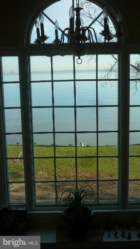 8563 Bay Road Pasadena, MD 21122 - Photo 14 of 25 Top staircase window to look over the river.