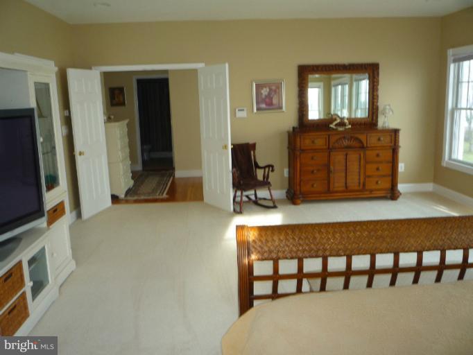 8563 Bay Road Pasadena, MD 21122 - Photo 17 of 25 Master Bedroom occupies one half of upstairs.