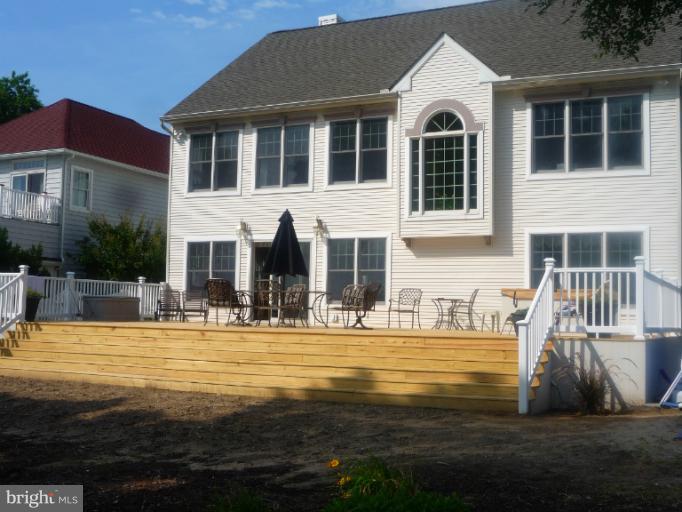 8563 Bay Road Pasadena, MD 21122 - Photo 20 of 25 Exterior (Rear) Deck extends 42 x 22 across back.